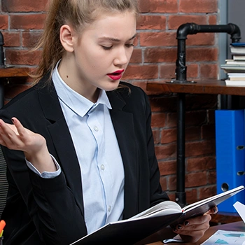 Woman following and reading the operating agreement