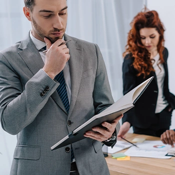 Man thinking deeply about the document he's reading