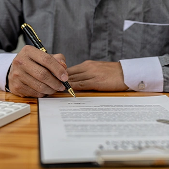 Someone signing a document