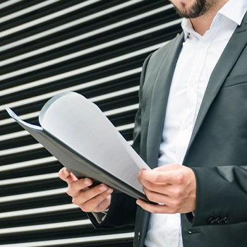 A businessman preparing his documents outside the building