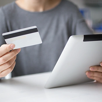 Holding a bank card and a tablet