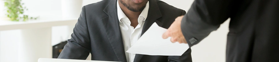 A man studying teh steps on dissolving an LLC in New Jersey