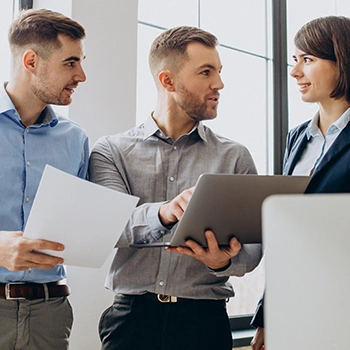 Three members of an LLC having a discussion about their capital contributions