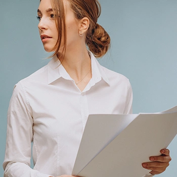 Young woman in long sleeves holding LLC Annual Report