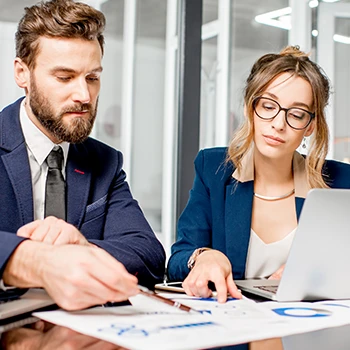 Two workers busy in office