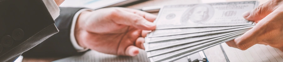 An office worker paying another person