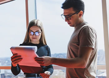 Two employees looking up how an LLC is usually taxed