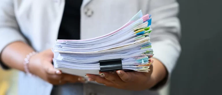 A man holding documents about LLC asset protection