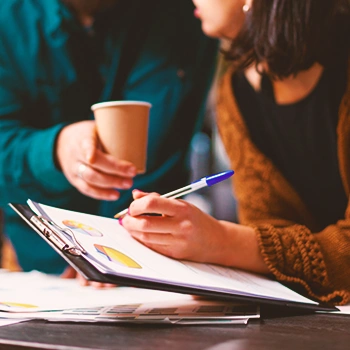 Two colleagues discussing a form