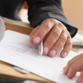 A man consulting an LLC Operating Agreement