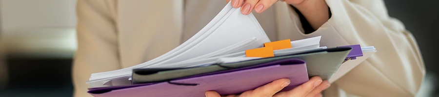 A woman organizing the documents after the dissolve of an LLC in Virginia