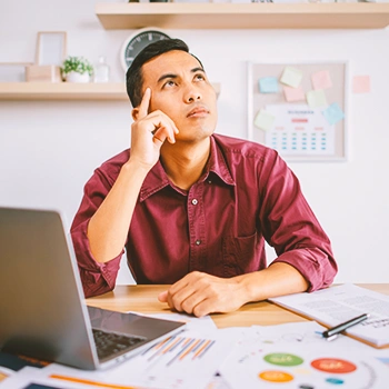 A man thinking in office