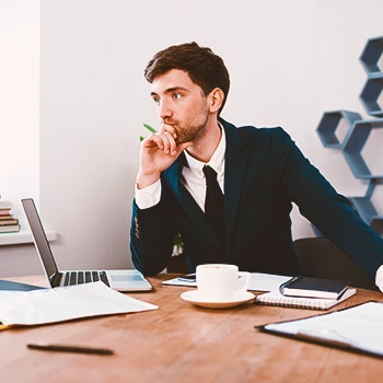 An LLC boss thinking in his office