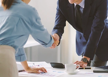 Two coworkers shaking hands