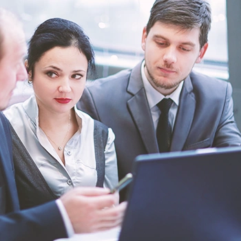 A group of employees discussing about how to dissolve an llc in maine