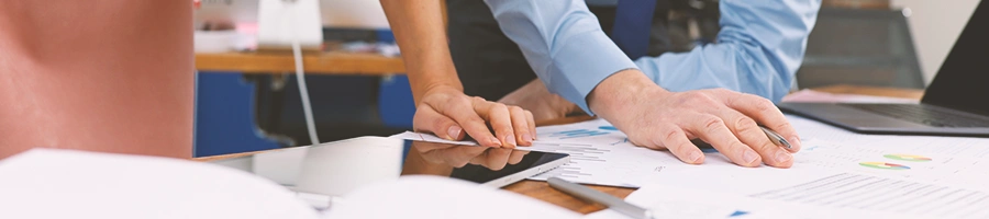 Office workers calculating numbers