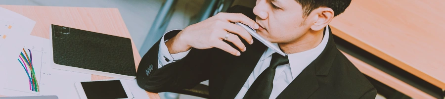 A man seriously looking at paperwork