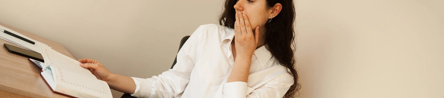 A woman shocked at paperwork