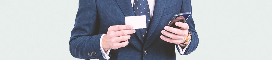 A man holding a white card