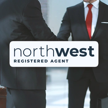 Northwest Registered Agent logo in front of two businessmen shaking hands