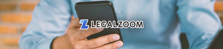 A person holding a phone with the legalzoom logo in front