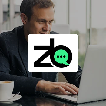 A business man working on a laptop as a background and a logo of ZenBusiness