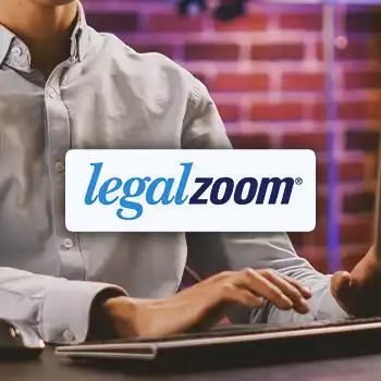 Legalzoom logo with a business person doing work in the background