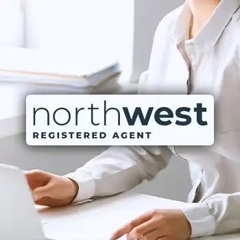 Northwest Registered Agent logo with an office worker doing work in the background