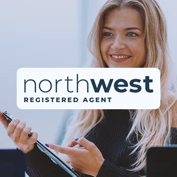 Northwest Registered Agent Service logo with an office worker in the background