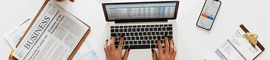 A top view image of a woman using a laptop