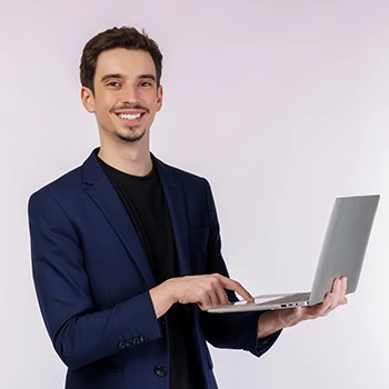 An image of a man holding a laptop and searches for LLC in Texas