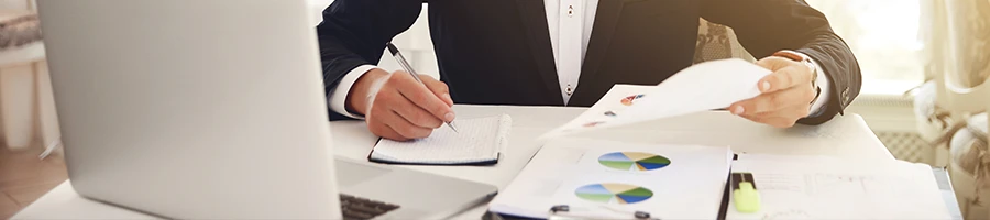 A business man working on papers needed to reserve his business name