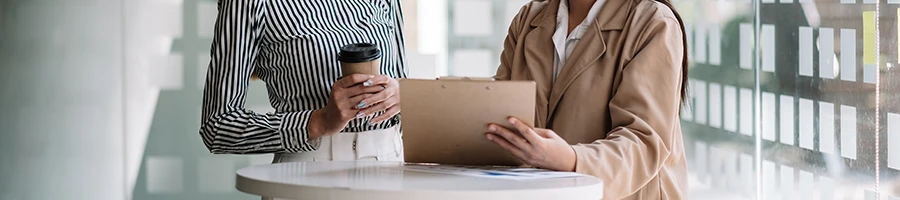 Two women talking about Vermont's LLC selection process