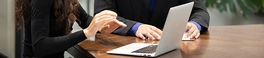 Two professionals having a discussion in an office