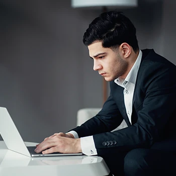 A young business man working on his laptop