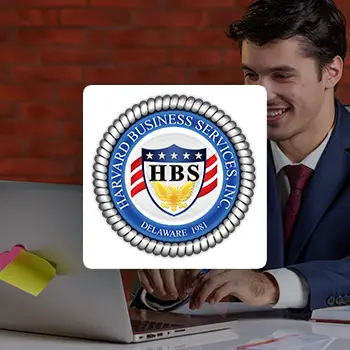 Delaware Inc logo with a background of a smiling young man using a laptop