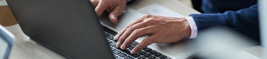 A man using a laptop in an office