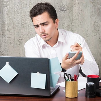 A worried man writing down notes about the downsides of BizFilings