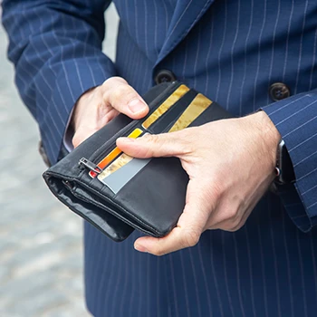 A business man checking his wallet