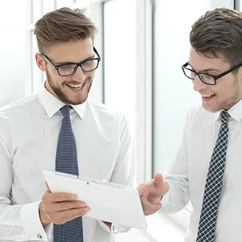 Two men talking about business in an office