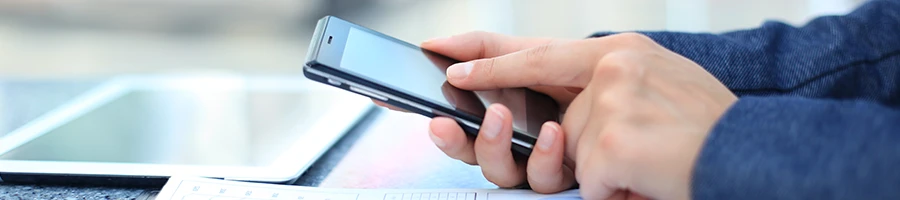 A business woman using a smartphone