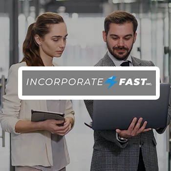 Two business people looking at a laptop and a logo of Incorporate Fast