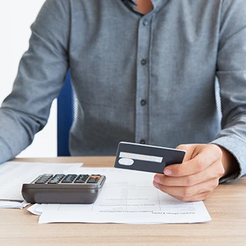 A business man computing his taxes on a desk