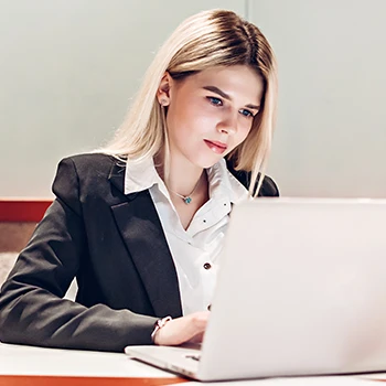 A busy woman working on her laptop