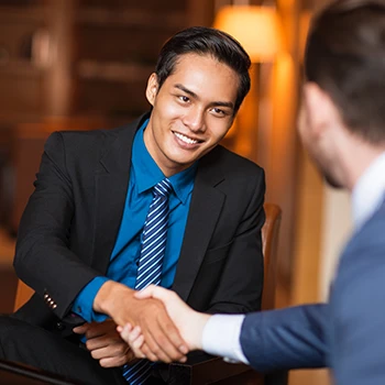 Two business men having a deal and shaking hands