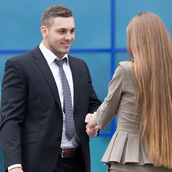 A man and a woman having a deal outside the office