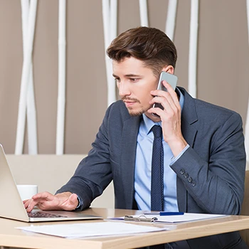 A business man working on his laptop to apply for employer identification number