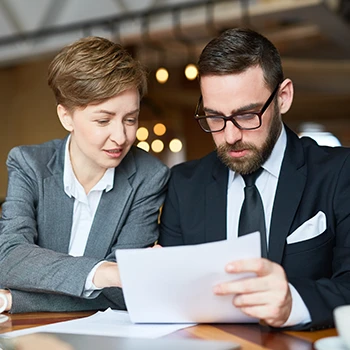 Two business people discussing the LLC annual registration in Georgia