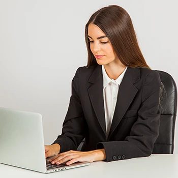 A young business woman working on her laptop