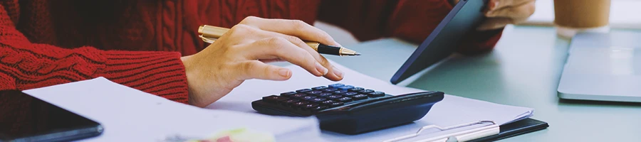 An office worker calculating the cost of an LLC in Montana